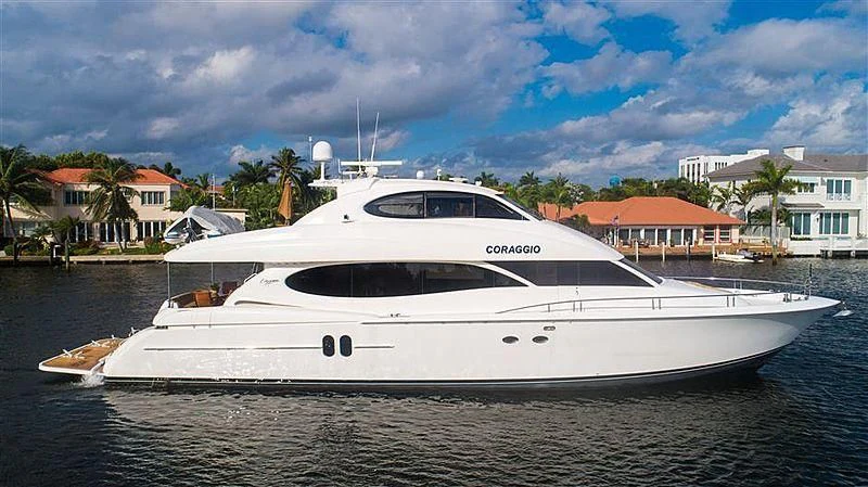 a white yacht on a beach aboard CORAGGIO Yacht for Sale