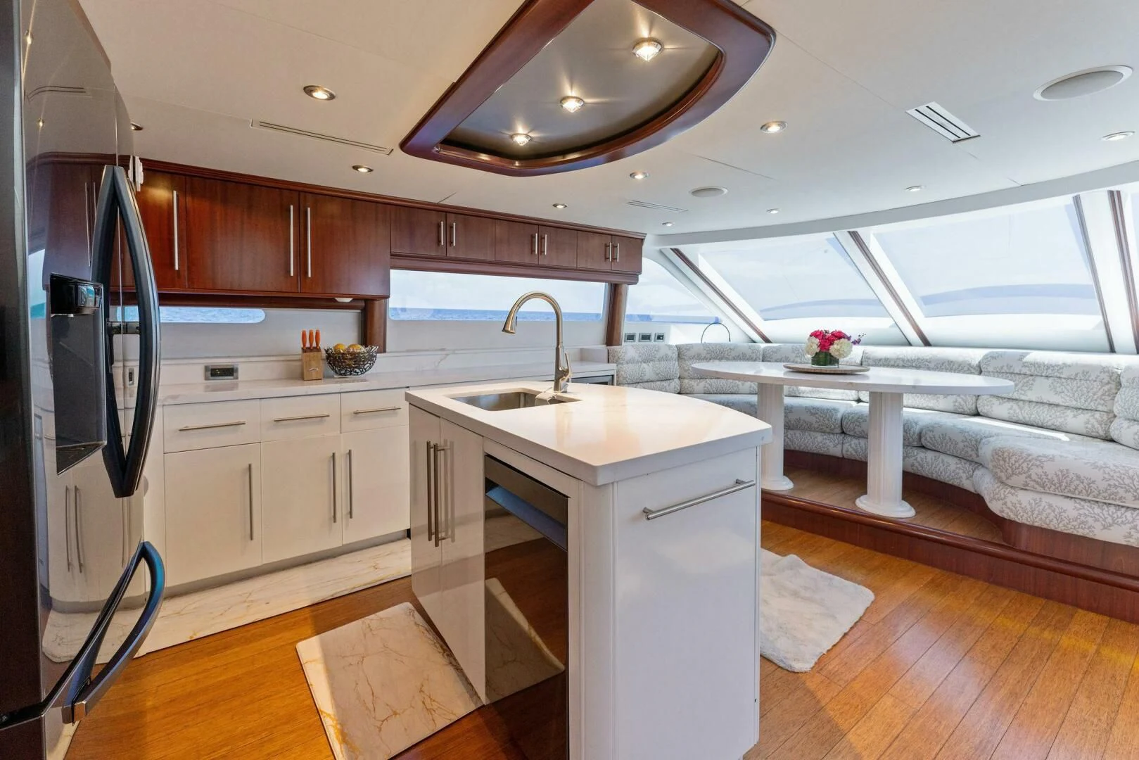 a kitchen with a large window aboard CORAGGIO Yacht for Sale