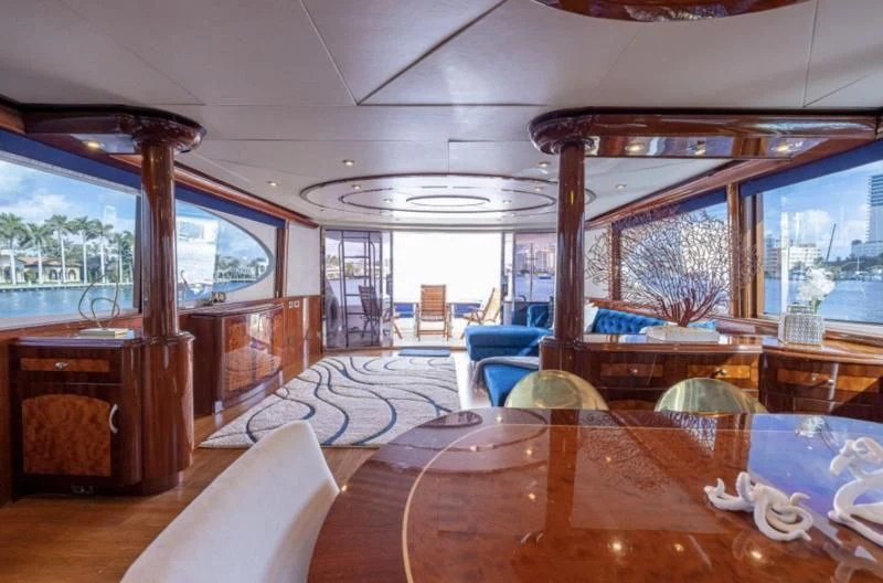 a living room with a large window aboard CORAGGIO Yacht for Sale