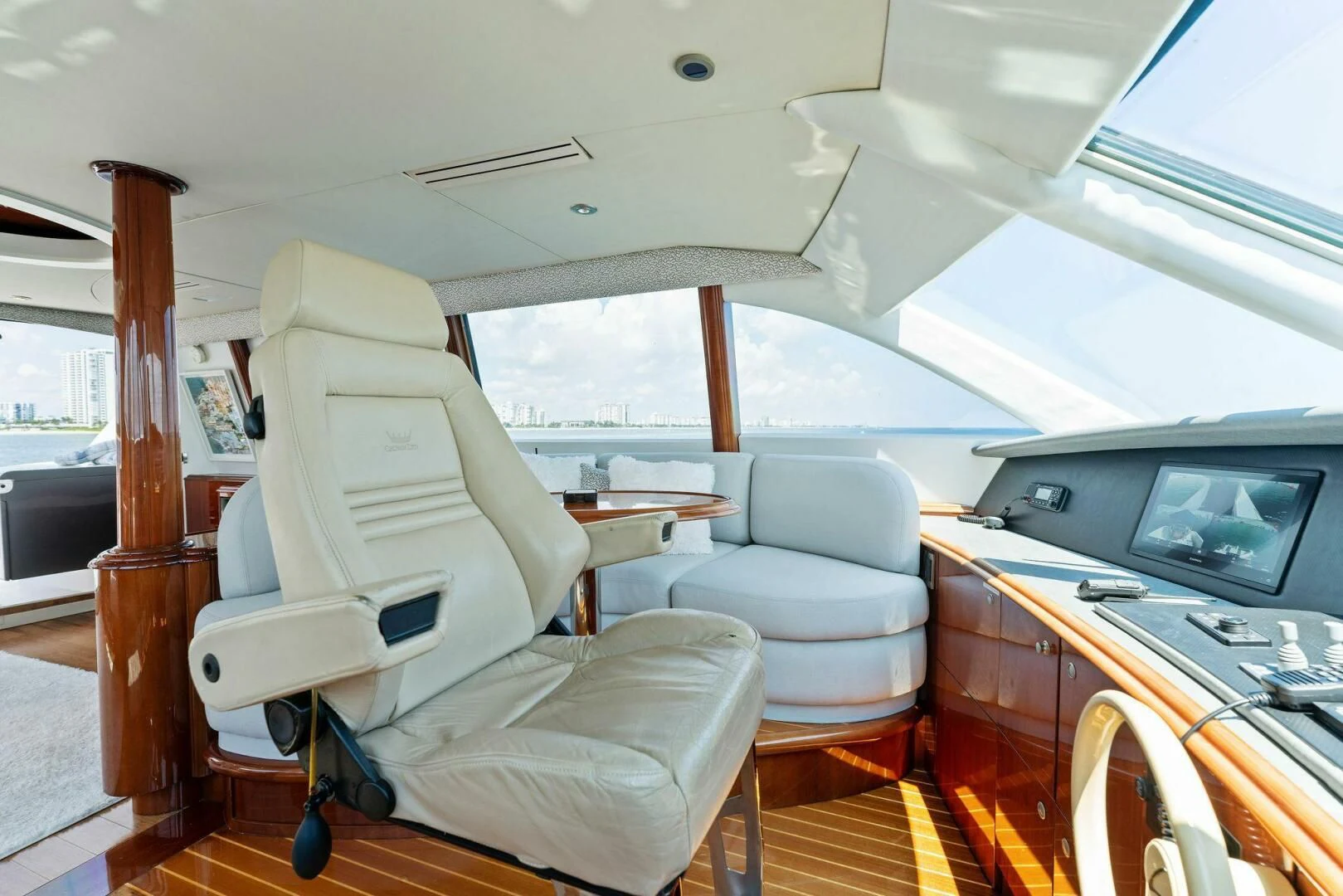 inside of a vehicle with a television and a table and chairs aboard CORAGGIO Yacht for Sale