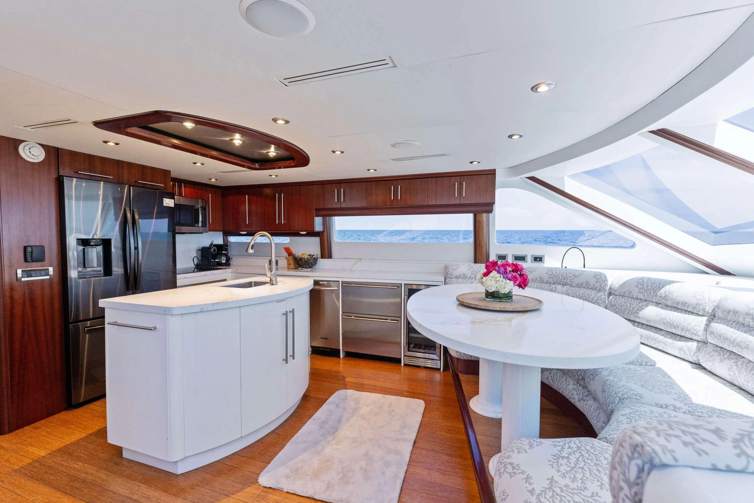 a modern looking kitchen with a large open floor plan aboard CORAGGIO Yacht for Sale