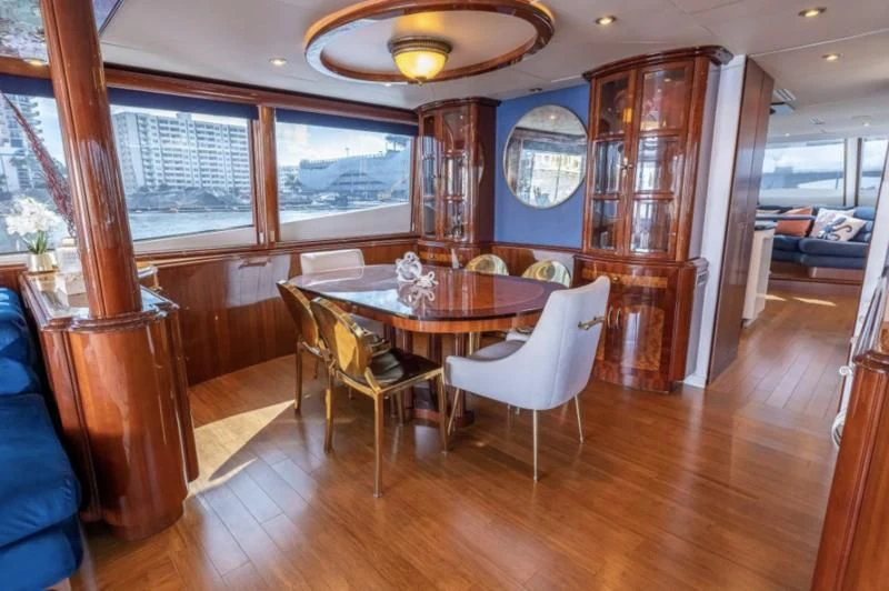 a dining room with a table and chairs aboard CORAGGIO Yacht for Sale