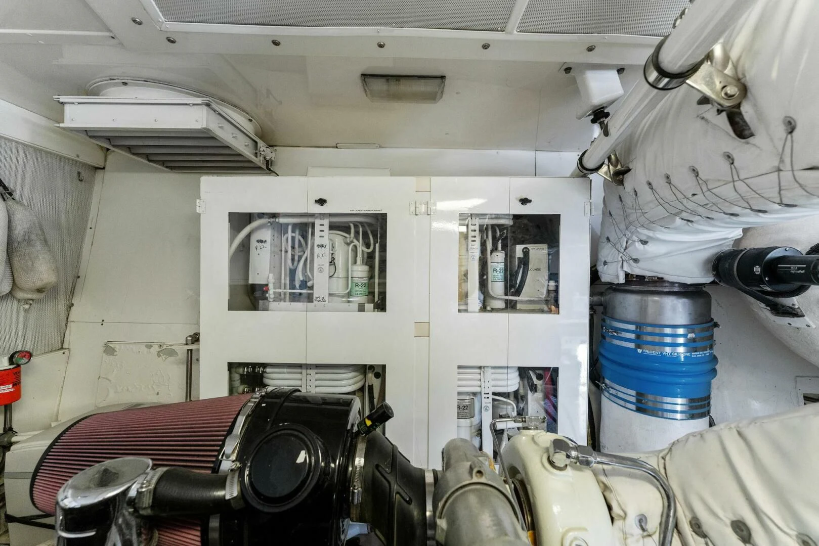 a room with a car and a large metal drum aboard CORAGGIO Yacht for Sale