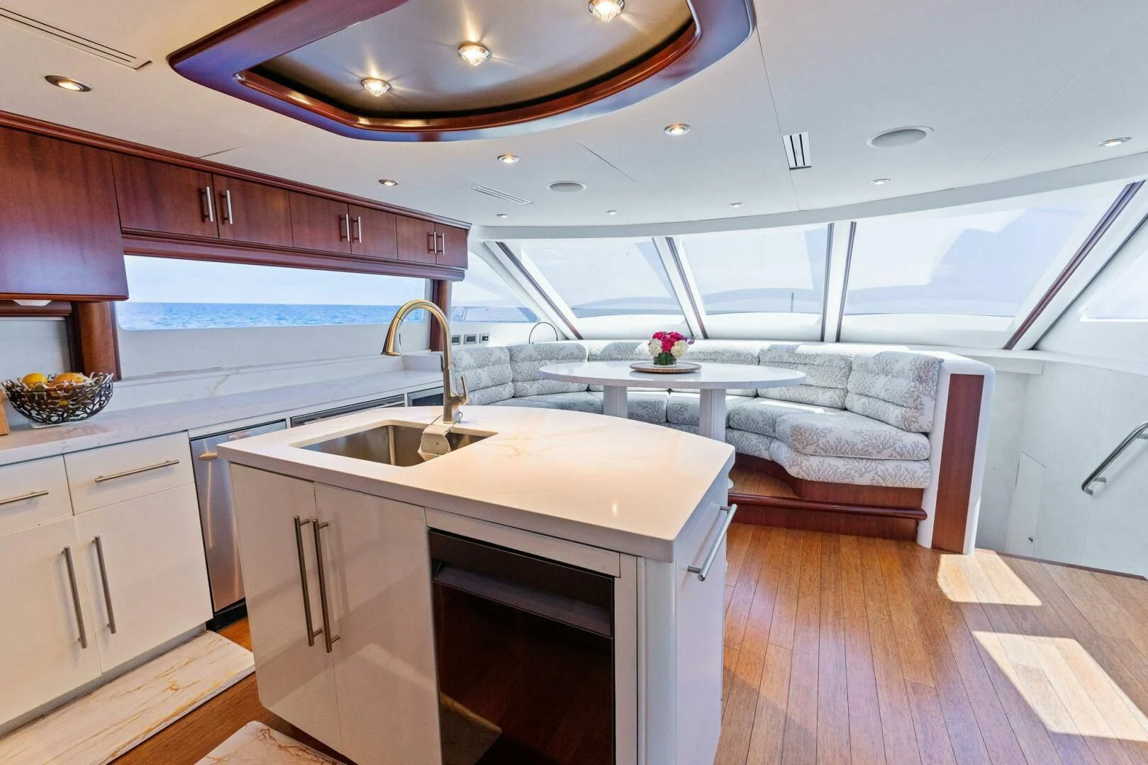 a kitchen with a sink and a couch aboard CORAGGIO Yacht for Sale