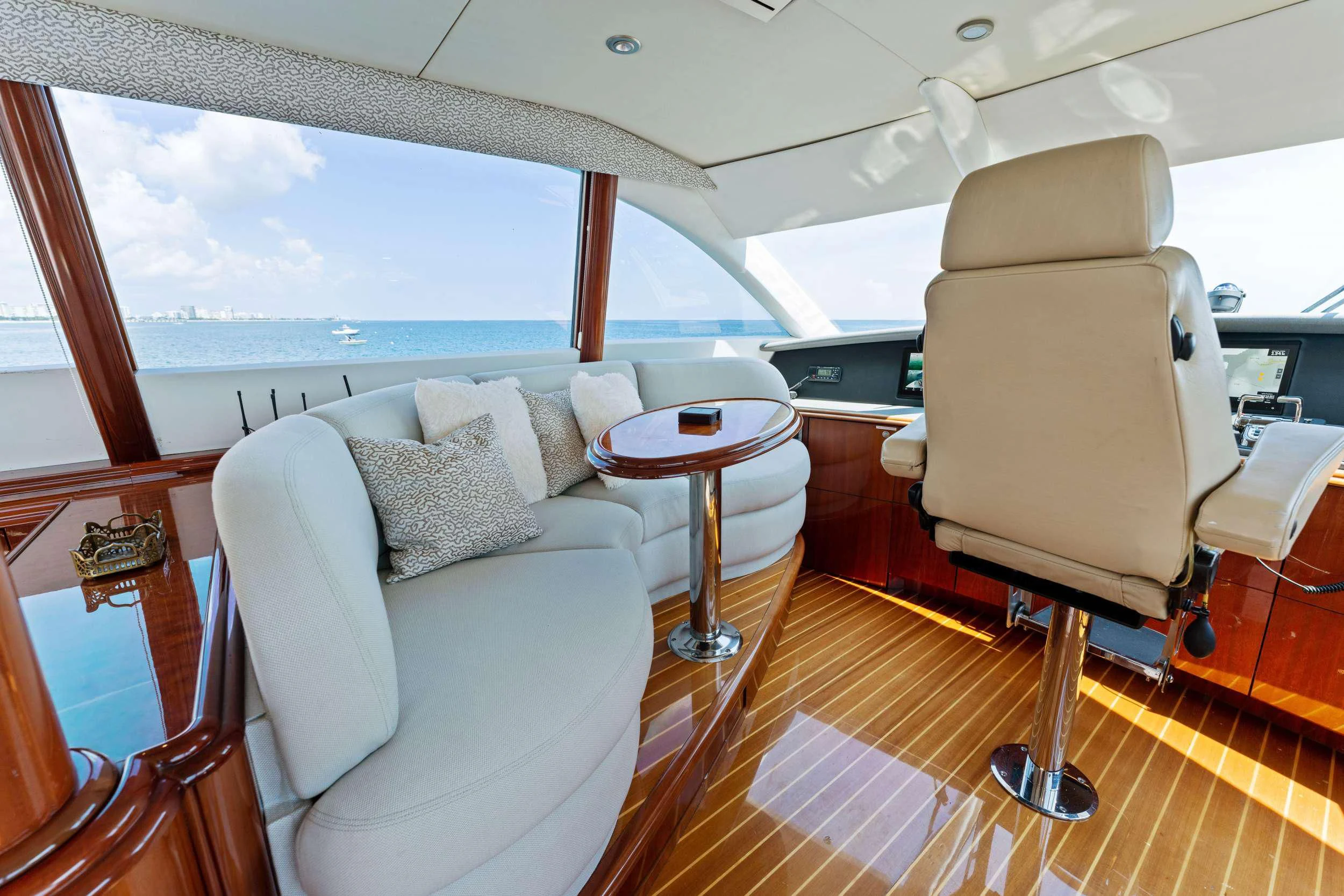 a room with a couch and a table and a window aboard CORAGGIO Yacht for Sale