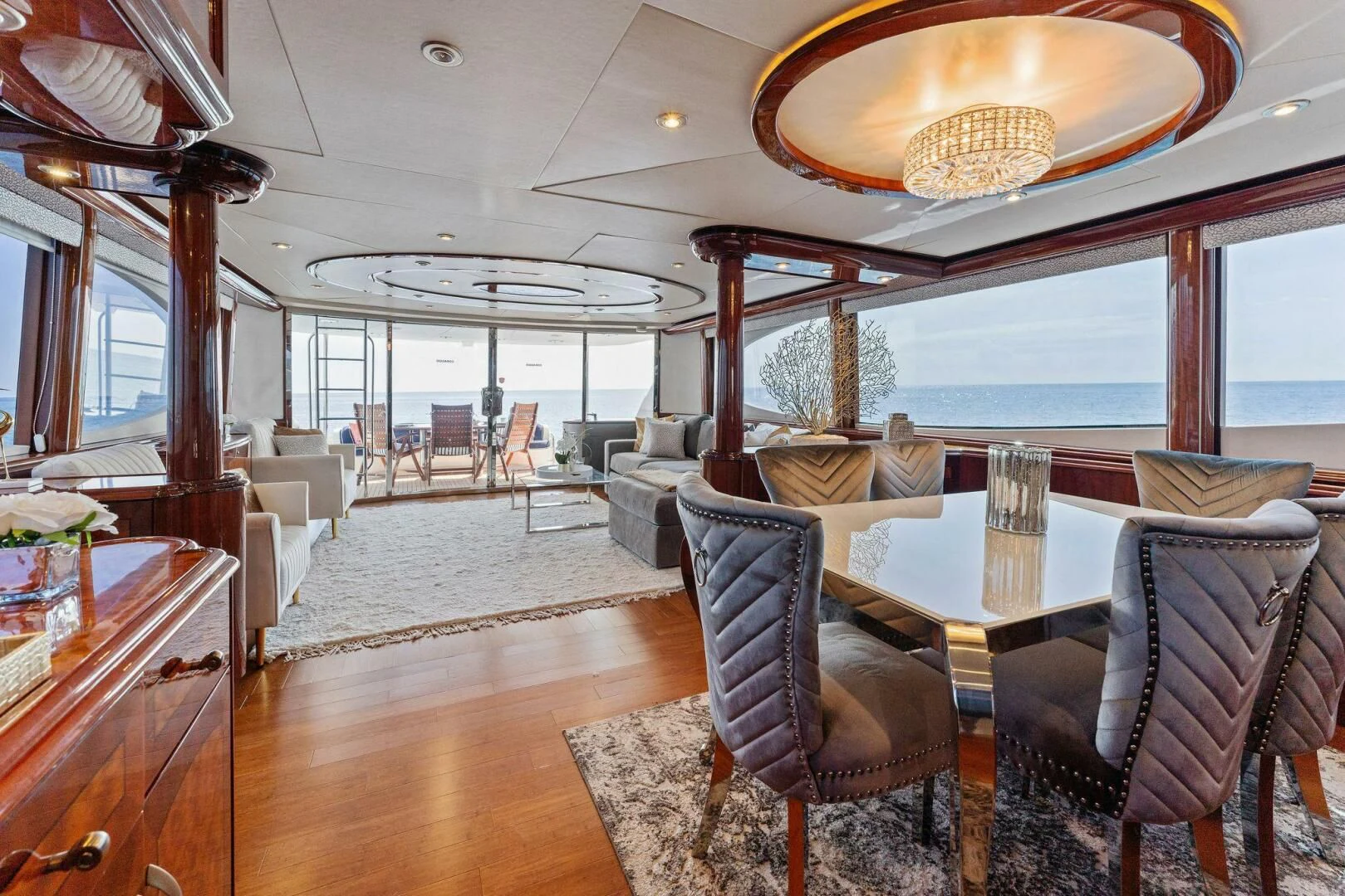 a large dining room with a large chandelier aboard CORAGGIO Yacht for Sale