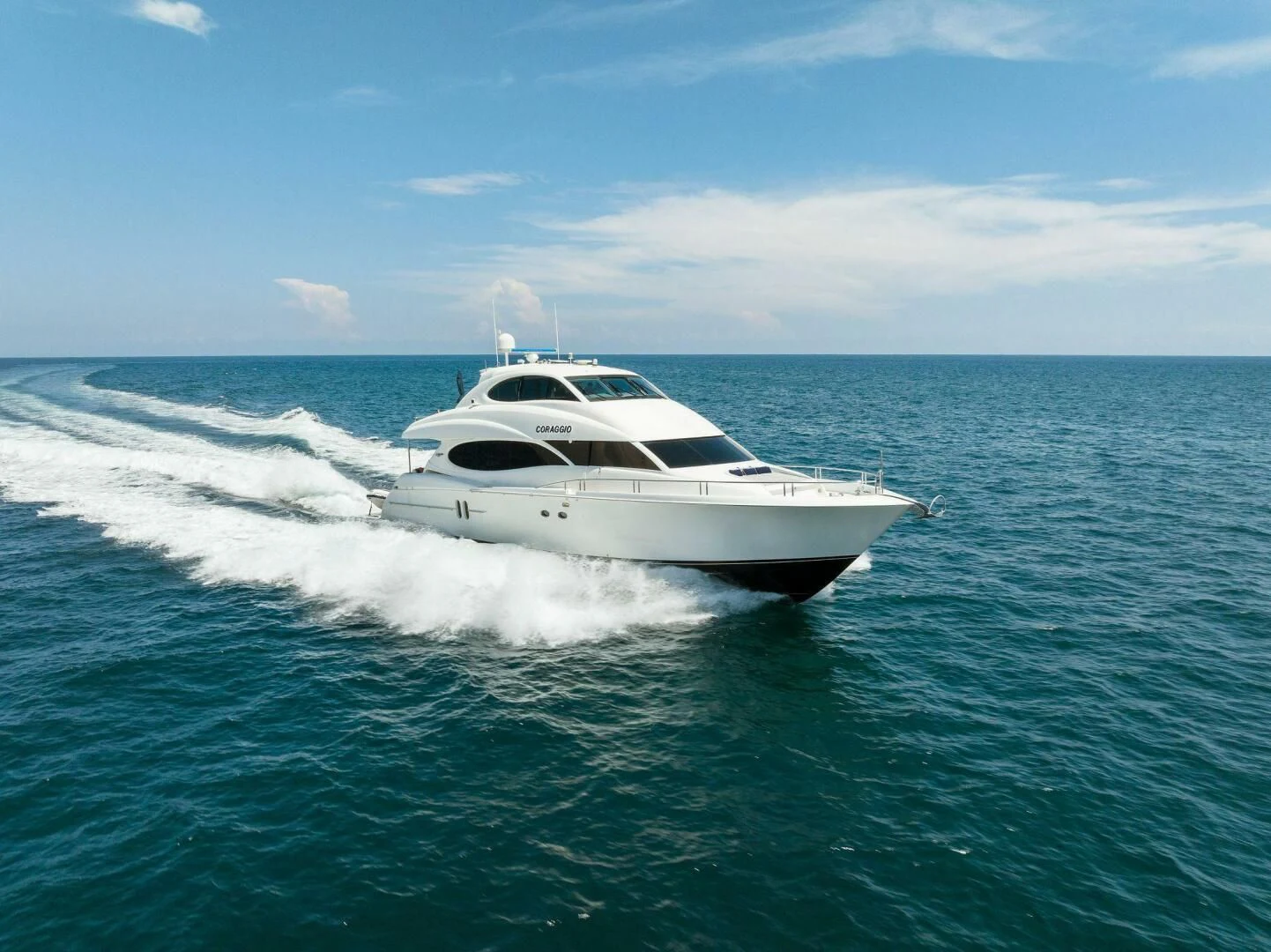a white yacht on the water aboard CORAGGIO Yacht for Sale