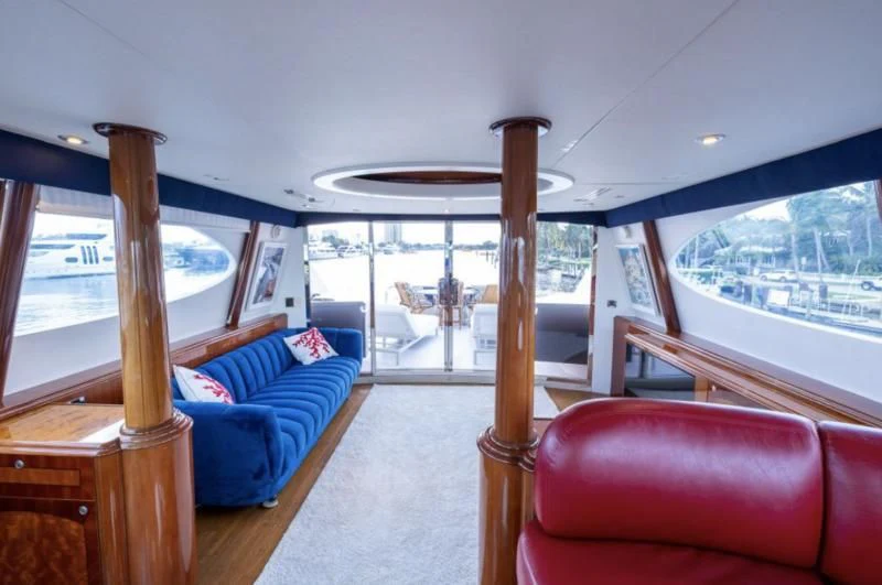 a living room with a large window aboard CORAGGIO Yacht for Sale
