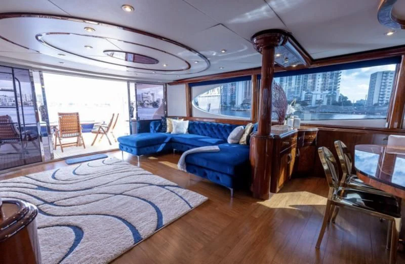 a large room with a bed and a chair aboard CORAGGIO Yacht for Sale