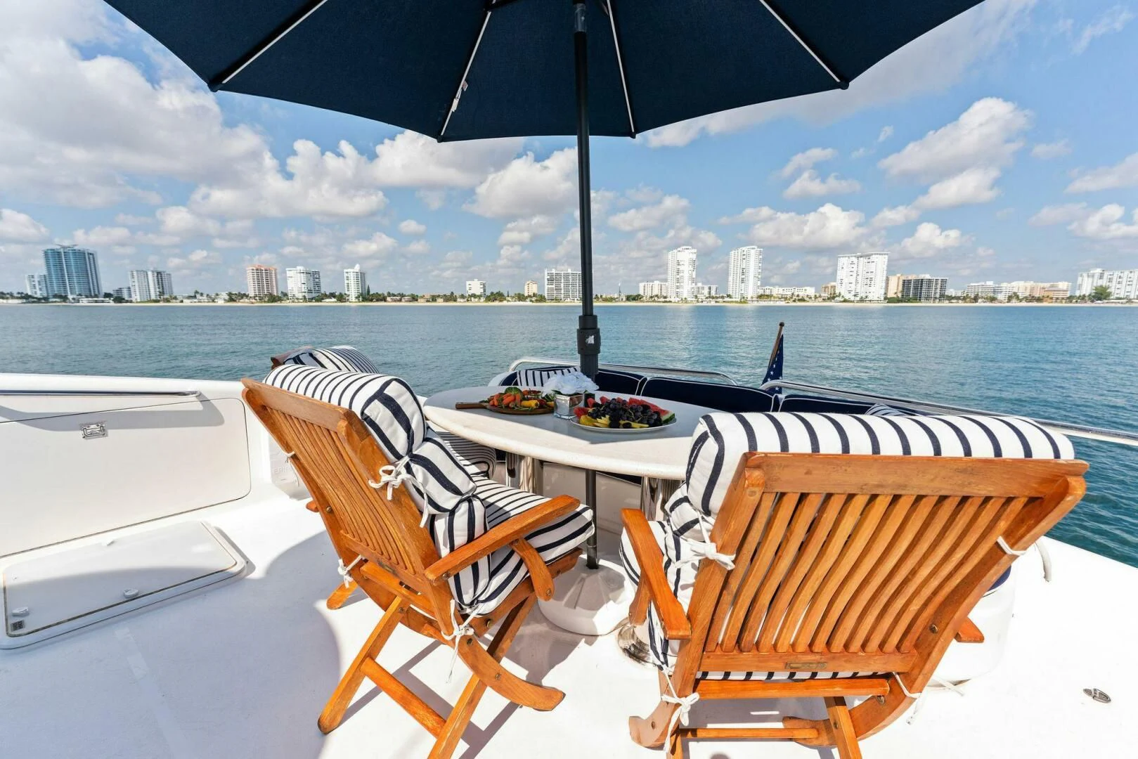 a couple of chairs and a table on a boat aboard CORAGGIO Yacht for Sale