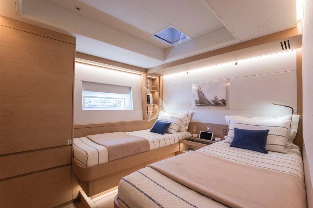 a room with two beds aboard KIWAYU Yacht for Charter