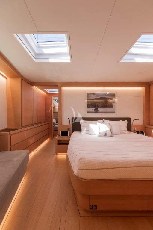 a bedroom with a bed aboard KIWAYU Yacht for Charter