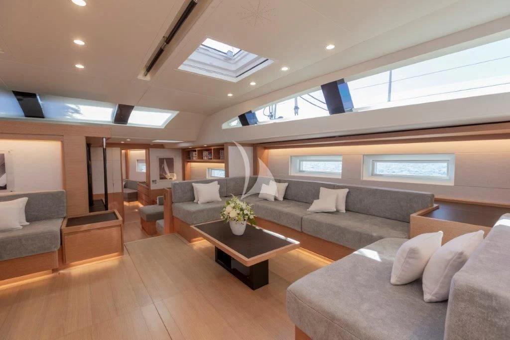 a living room with a couch and a coffee table aboard KIWAYU Yacht for Charter