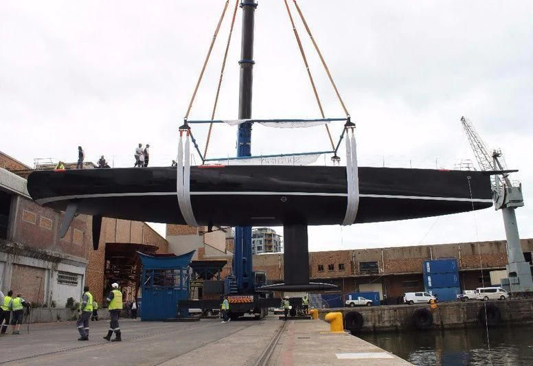 a large crane on a dock aboard KIWAYU Yacht for Charter