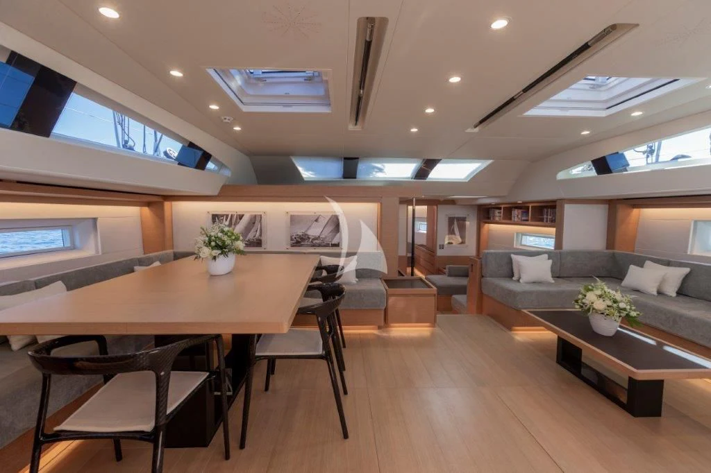 a room with a table and chairs aboard KIWAYU Yacht for Charter