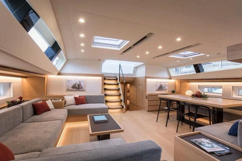 a living room with a ladder aboard KIWAYU Yacht for Charter