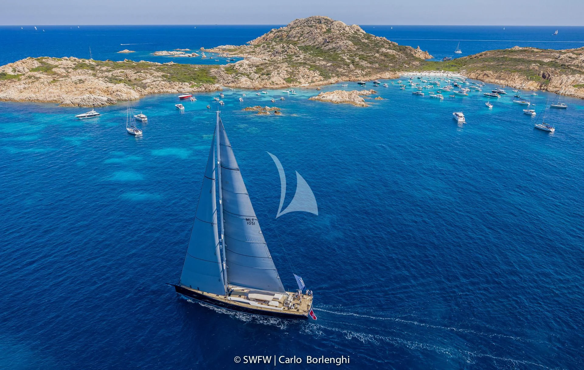 a boat sailing on the sea aboard KIWAYU Yacht for Charter