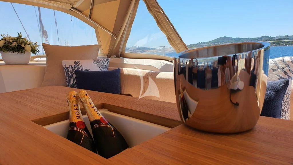 a wooden boat on a deck aboard KIWAYU Yacht for Charter
