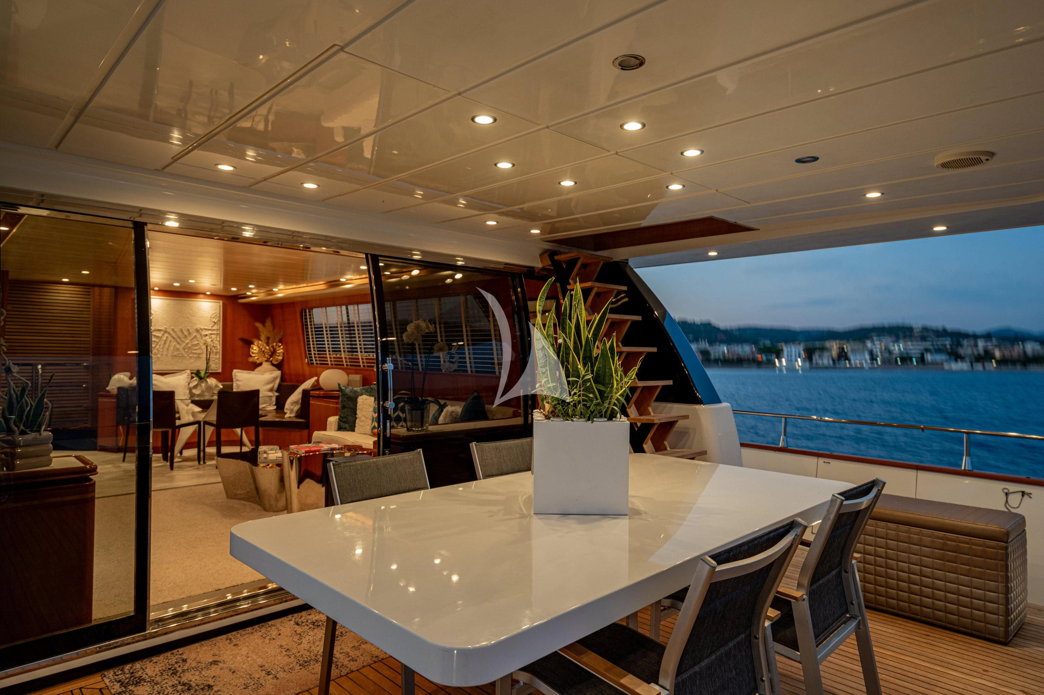 a room with a table and chairs aboard WHITEHAVEN Yacht for Sale