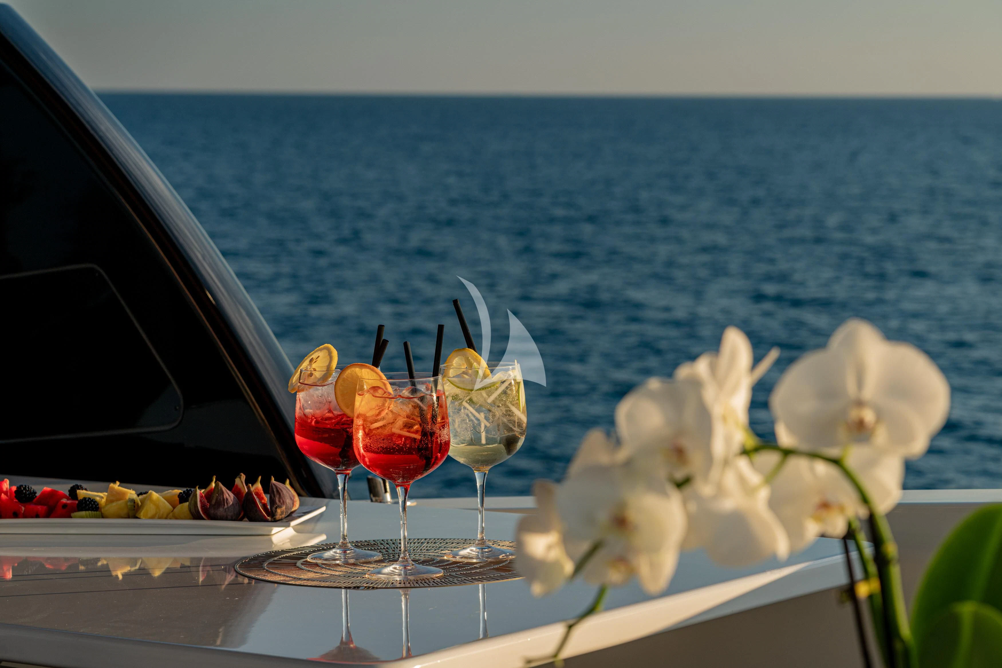 a table with wine glasses and flowers aboard WHITEHAVEN Yacht for Sale