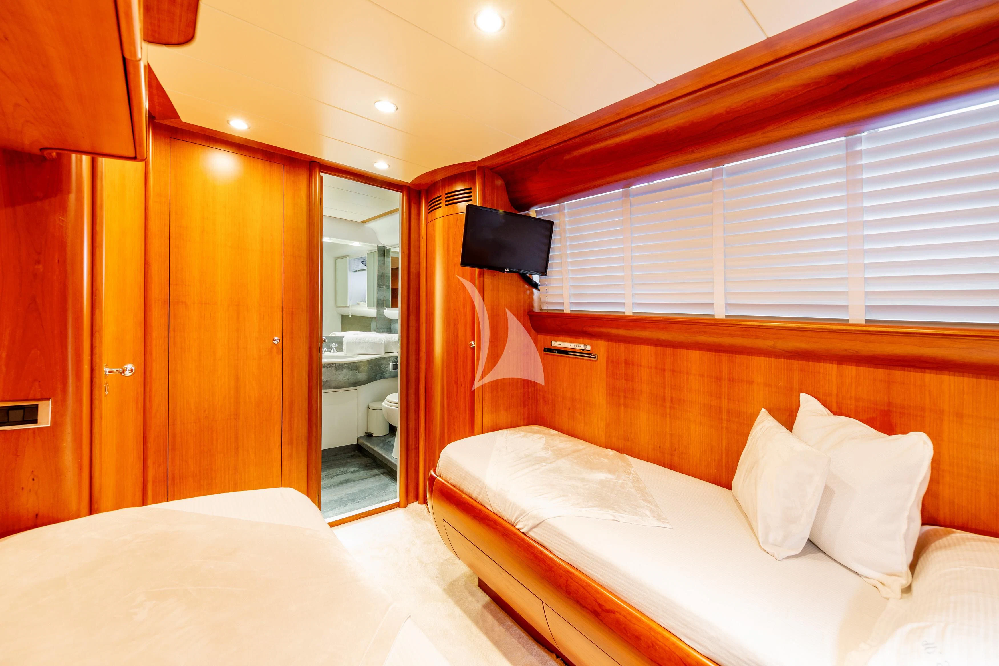 a room with a bed and a mirror aboard WHITEHAVEN Yacht for Sale