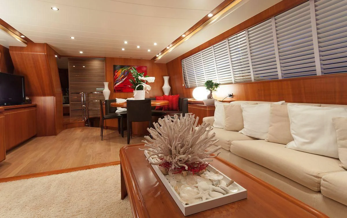 a living room with a couch and a coffee table aboard WHITEHAVEN Yacht for Sale