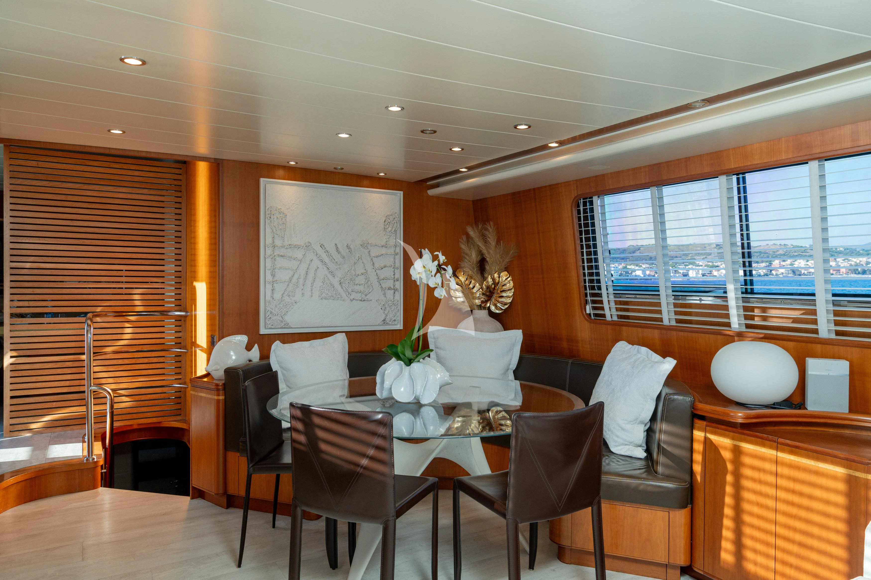 a dining room with a table and chairs aboard WHITEHAVEN Yacht for Sale