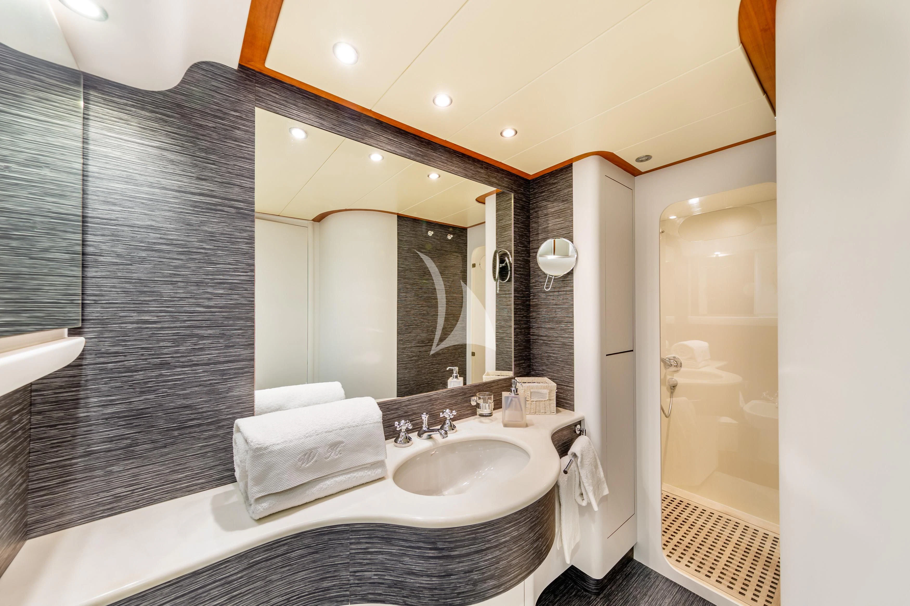 a bathroom with a large mirror aboard WHITEHAVEN Yacht for Sale