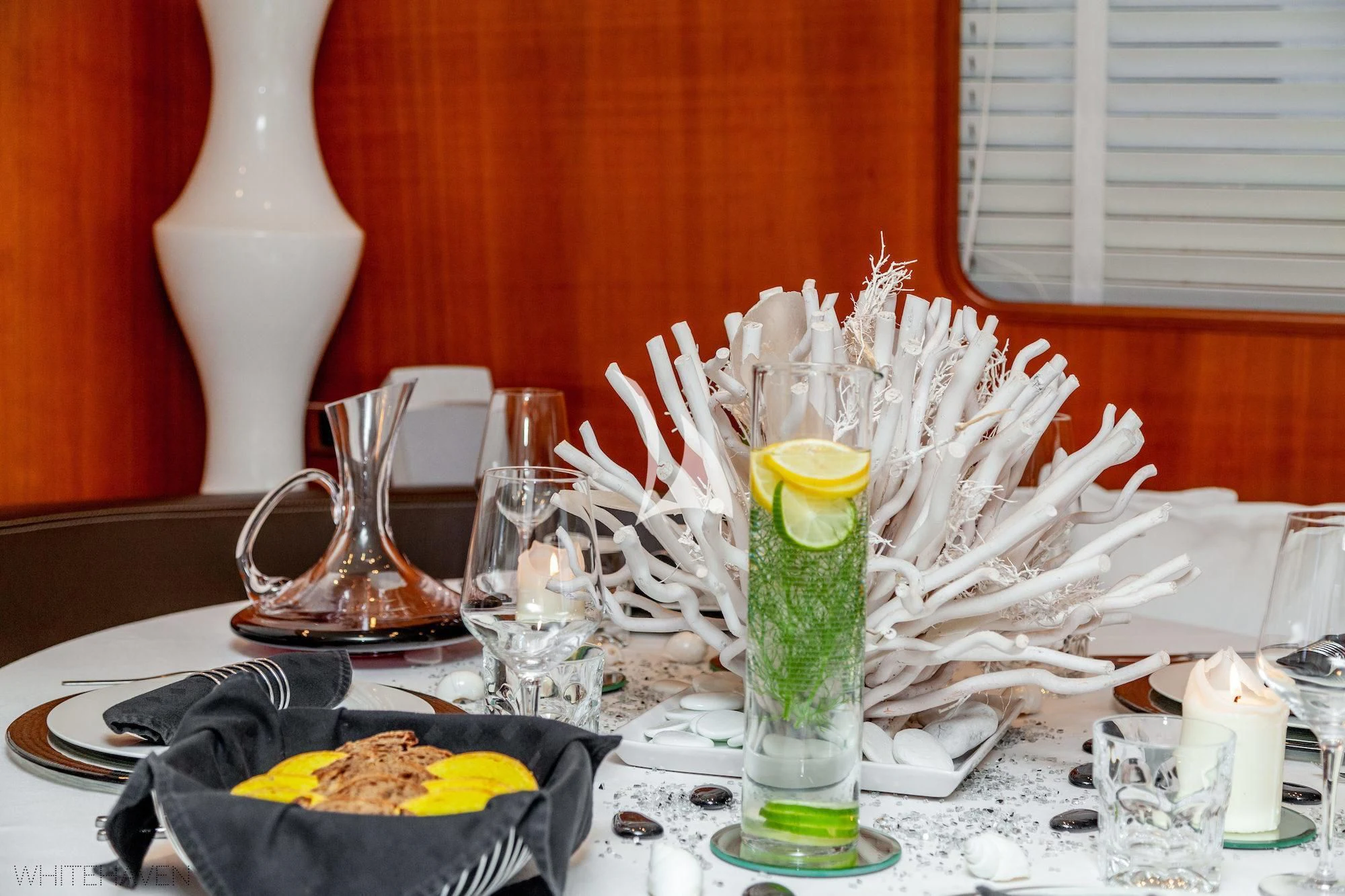 a table with a vase and flowers aboard WHITEHAVEN Yacht for Sale