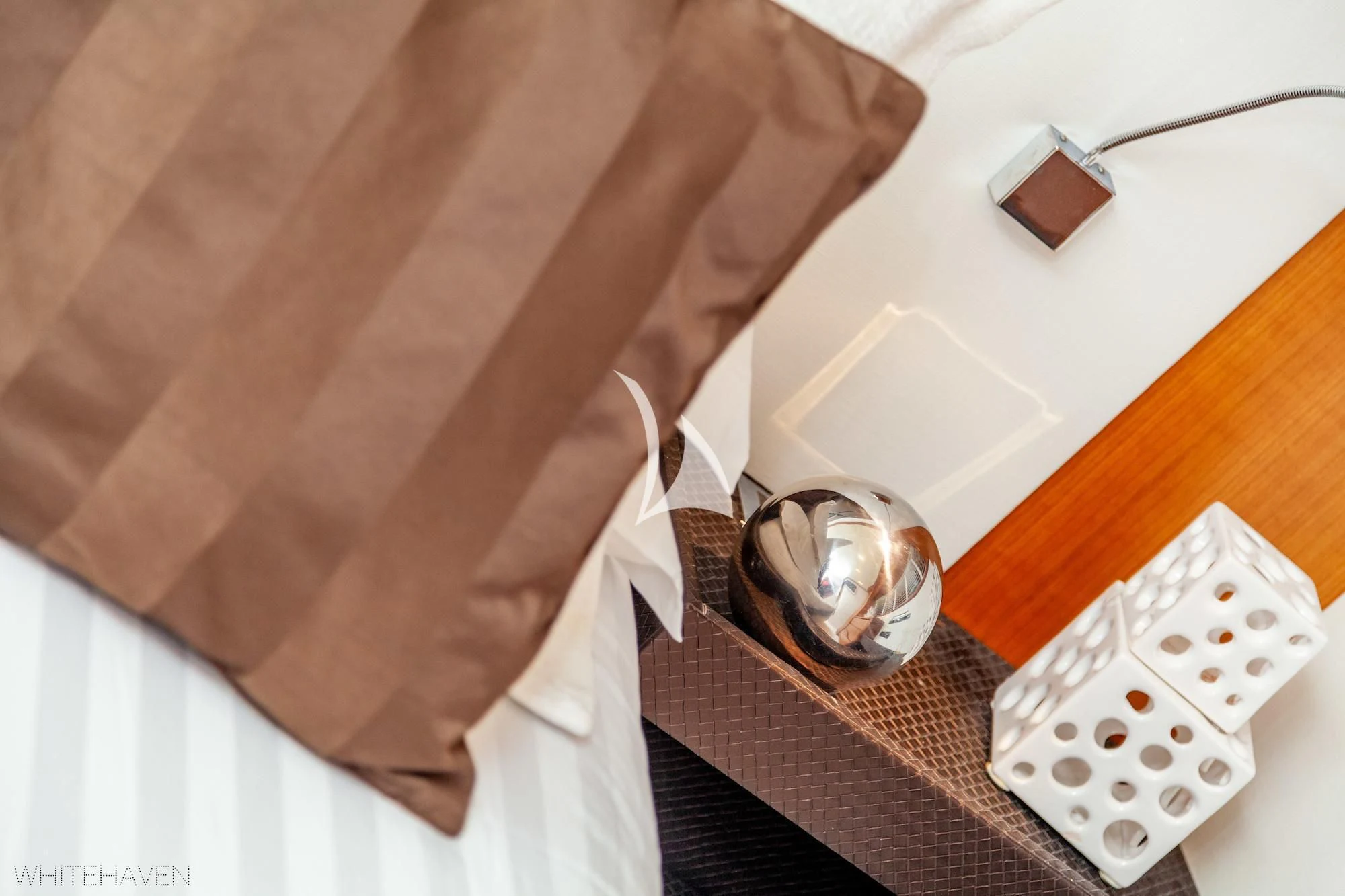 a guitar on a bed aboard WHITEHAVEN Yacht for Sale