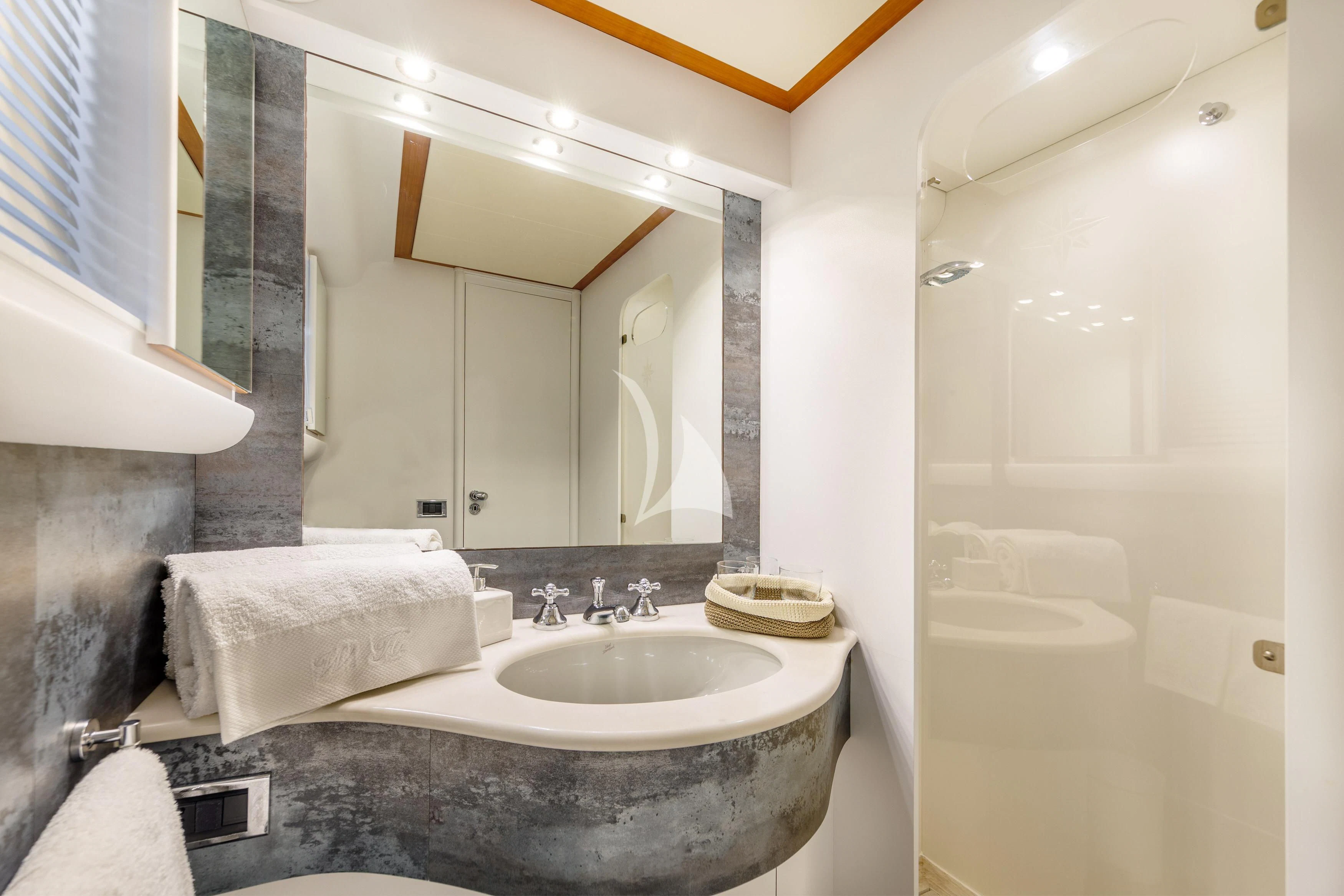 a bathroom with a large mirror aboard WHITEHAVEN Yacht for Sale