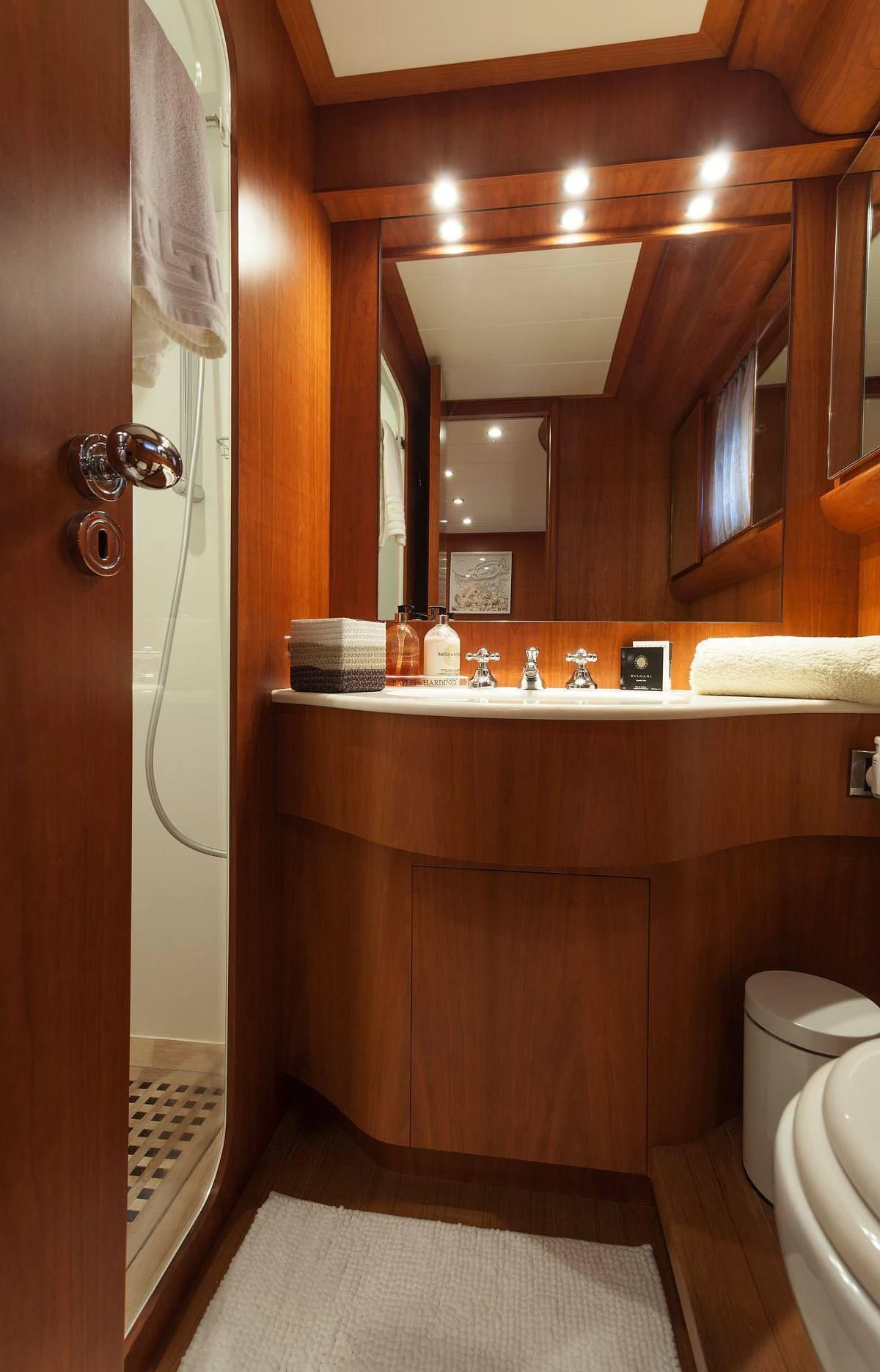 a bathroom with a sink and a toilet aboard WHITEHAVEN Yacht for Sale