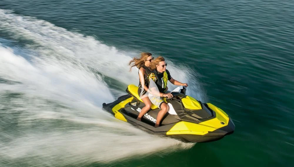 a couple of people in a yellow kayak on the water aboard WHITEHAVEN Yacht for Sale