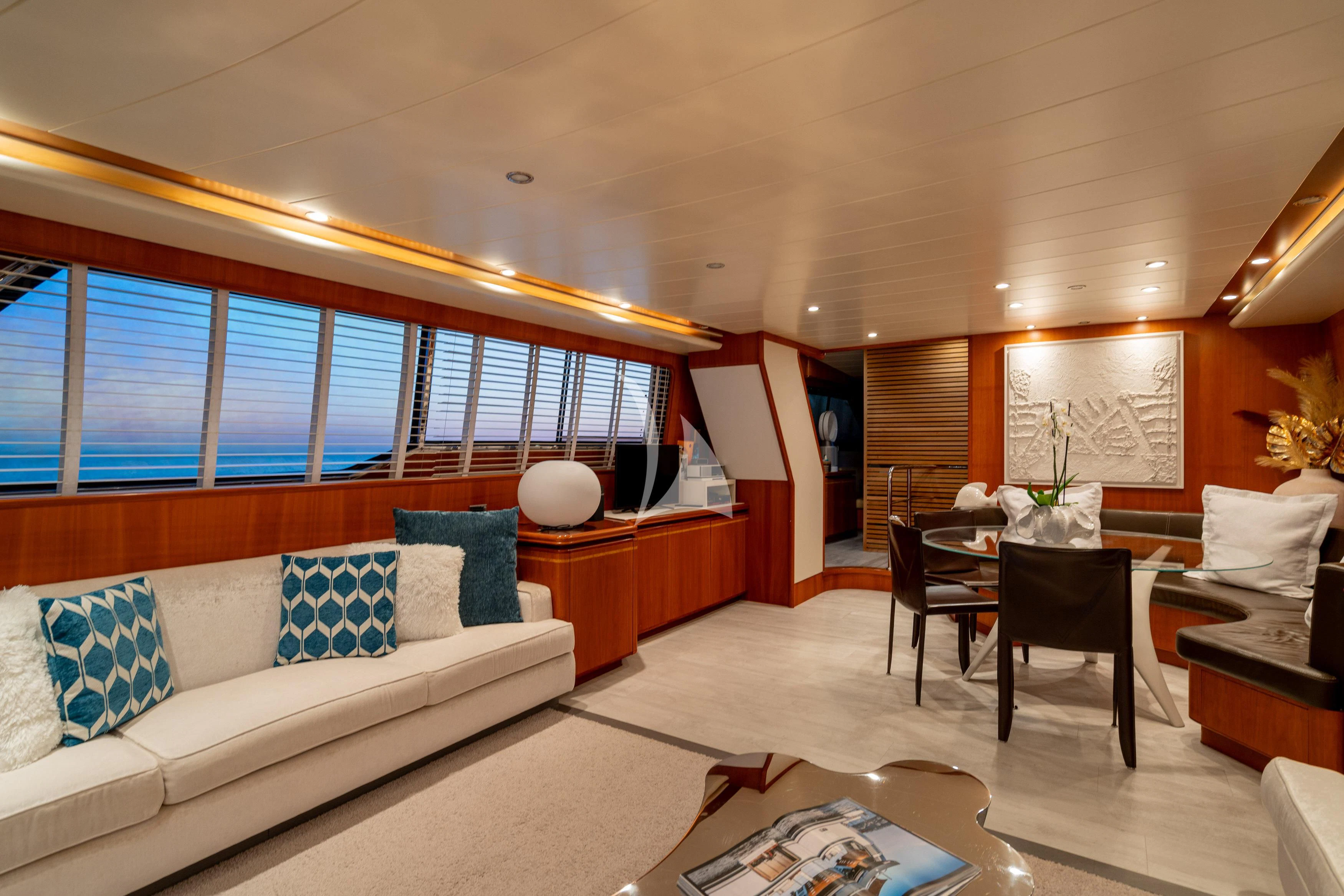 a living room with a couch and a table aboard WHITEHAVEN Yacht for Sale