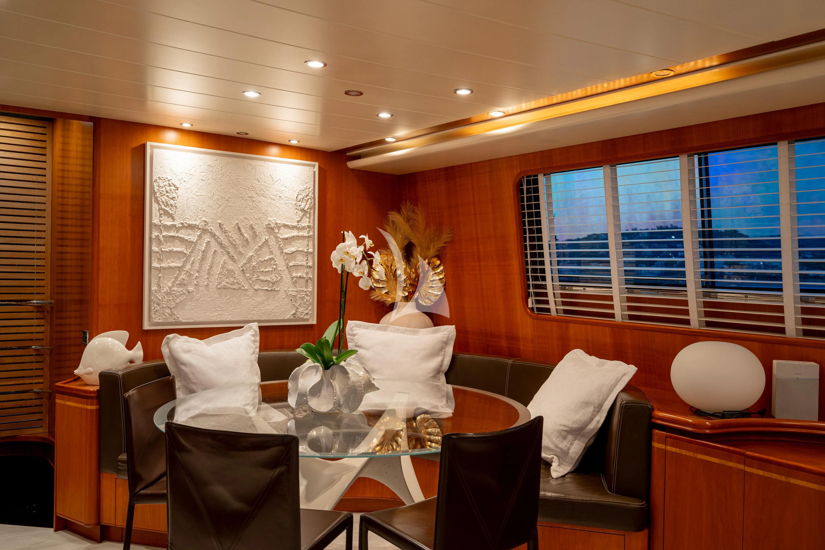 a room with a table and chairs aboard WHITEHAVEN Yacht for Sale