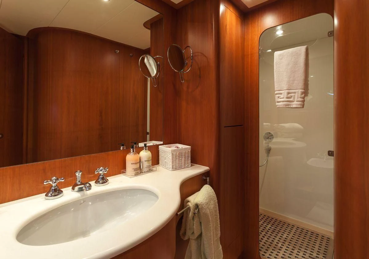 a bathroom with a sink and a shower aboard WHITEHAVEN Yacht for Sale