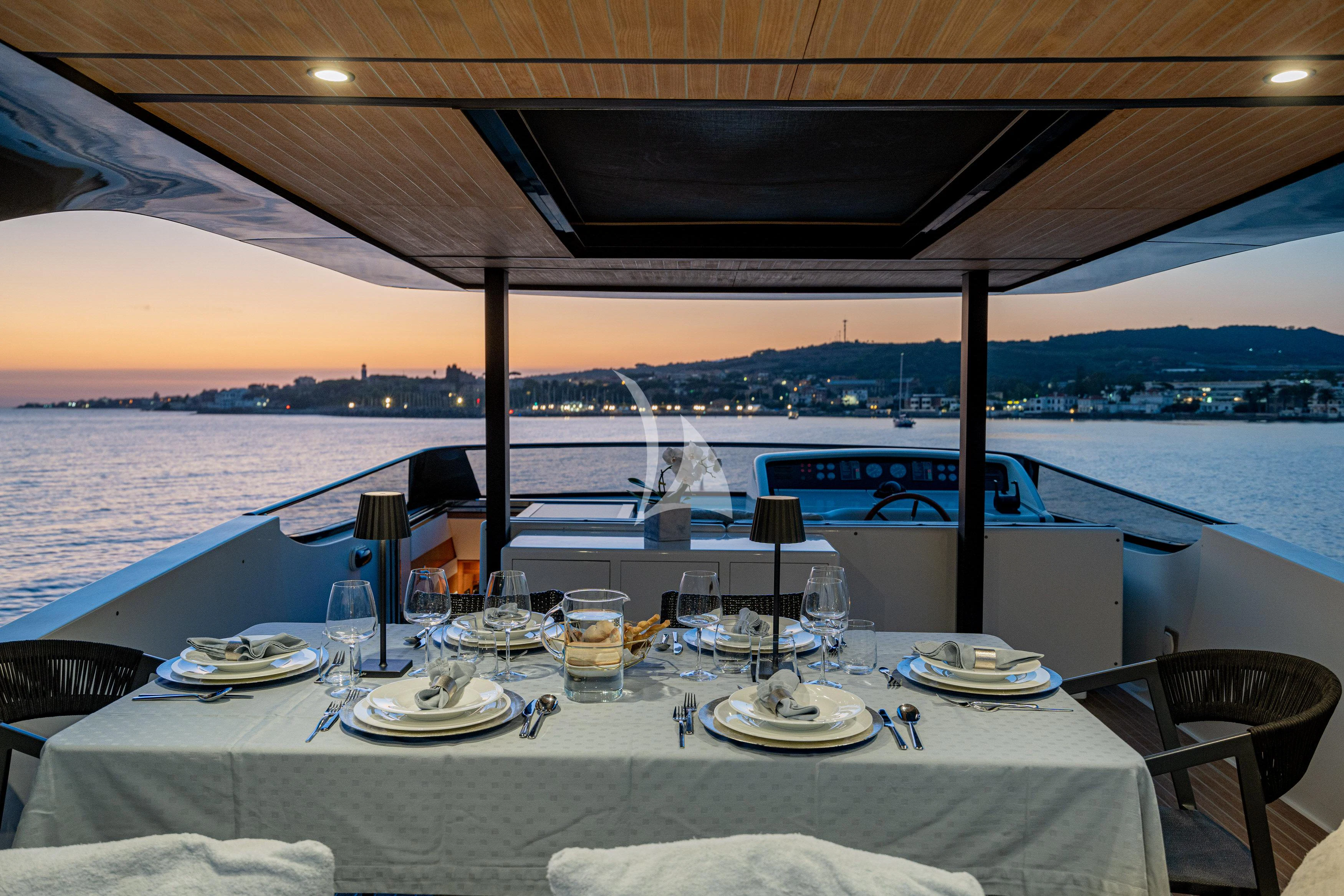 a table set for a meal on a boat aboard WHITEHAVEN Yacht for Sale