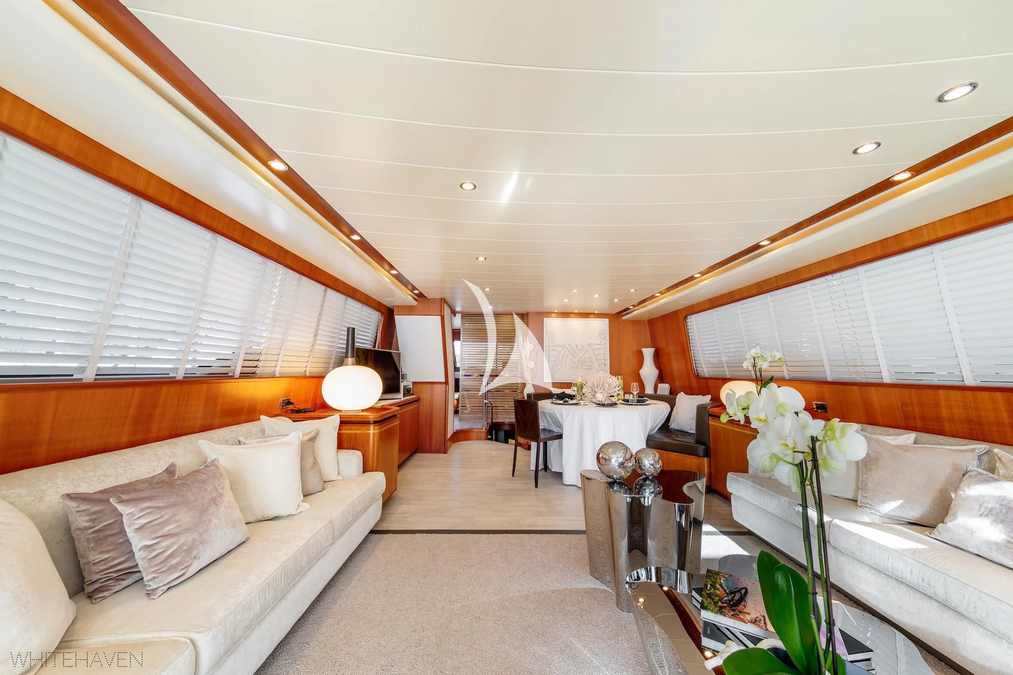 a room with a bed and a table aboard WHITEHAVEN Yacht for Sale
