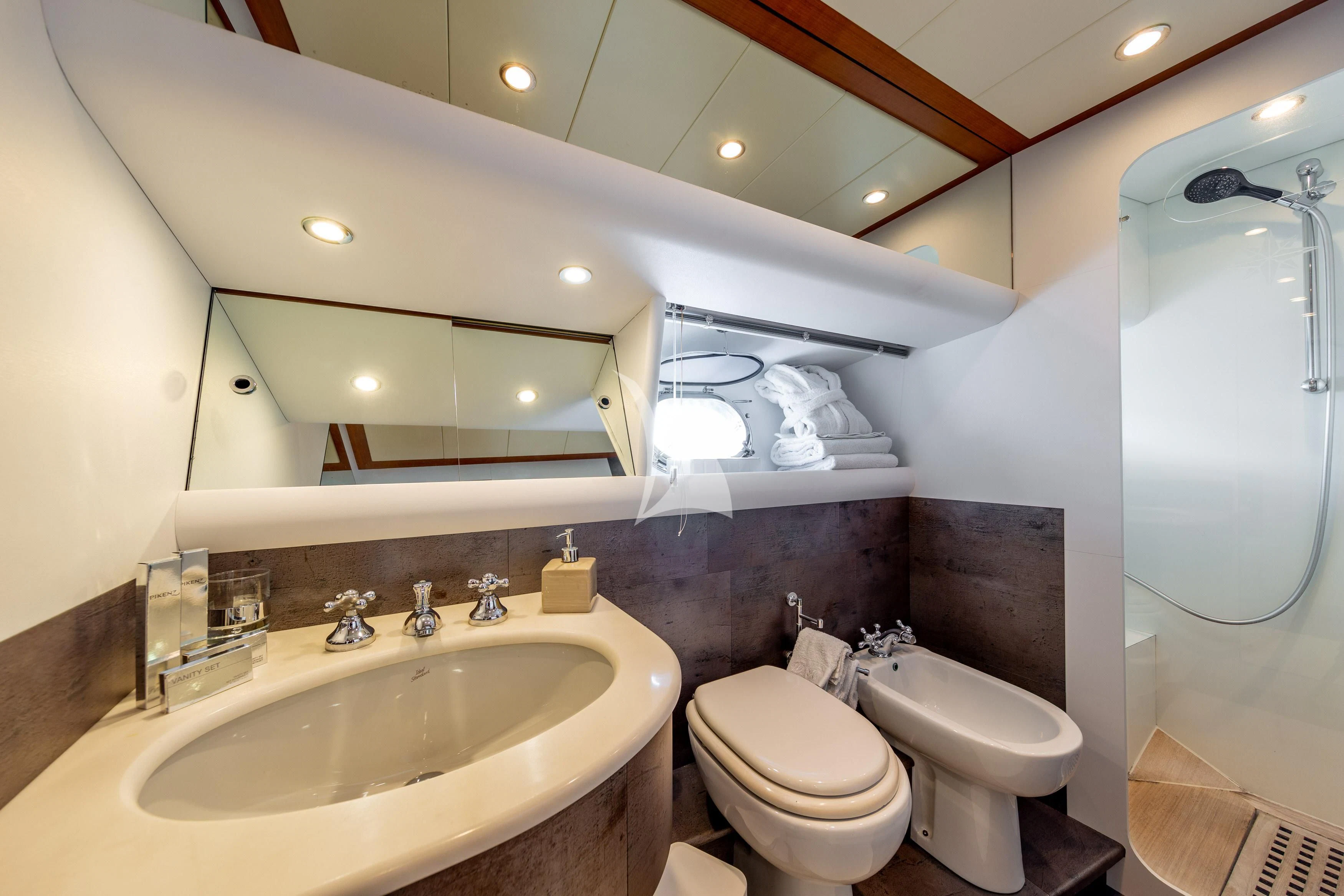 a bathroom with a large mirror aboard WHITEHAVEN Yacht for Sale