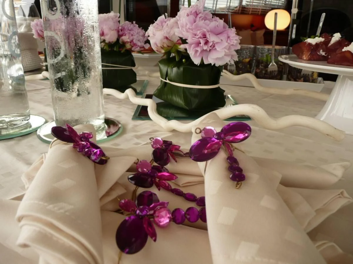 a table with flowers and a vase aboard WHITEHAVEN Yacht for Sale