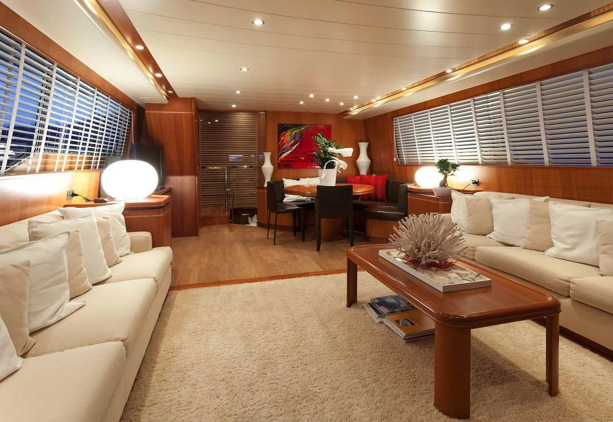 a living room with a couch and a coffee table aboard WHITEHAVEN Yacht for Sale