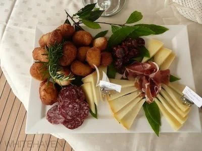 a plate of food aboard WHITEHAVEN Yacht for Sale