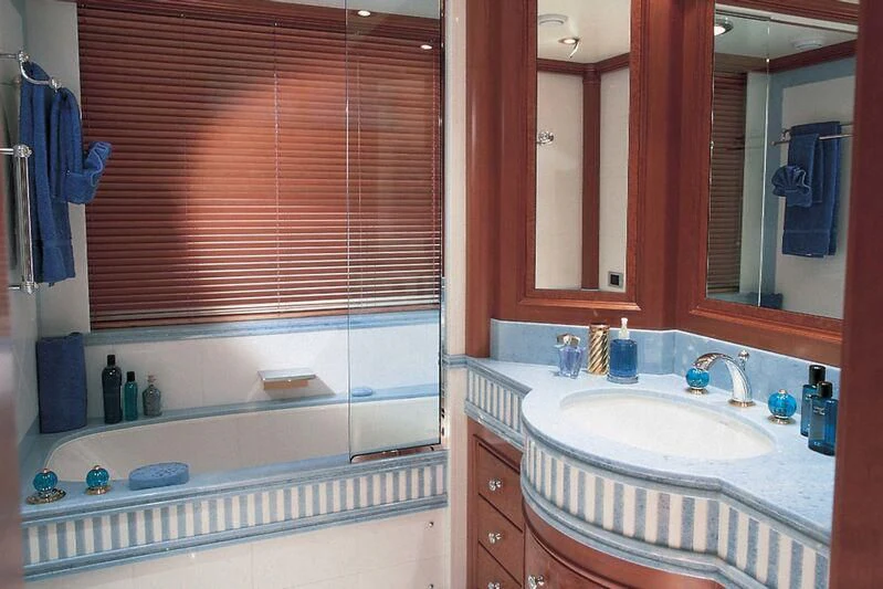 a bathroom with a sink and a mirror aboard CORINTHIAN Yacht for Sale