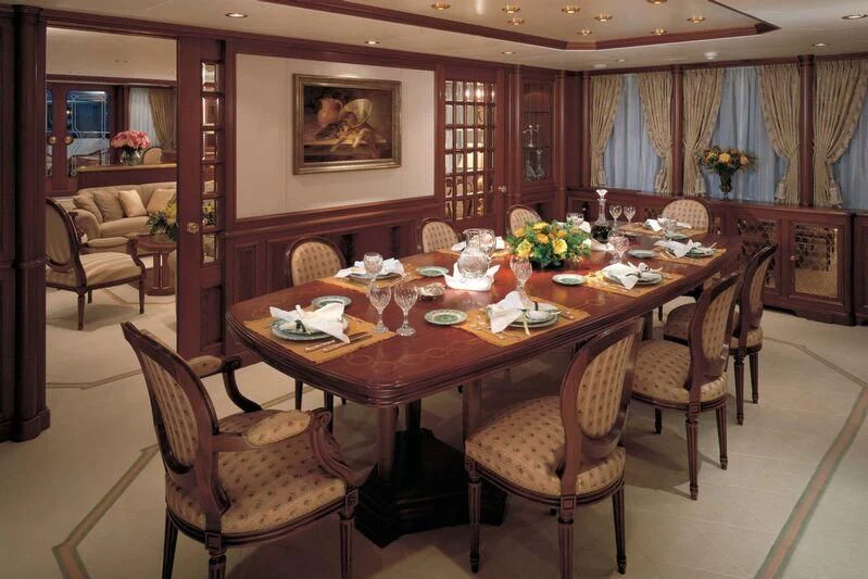 a dining table set for a family dinner aboard CORINTHIAN Yacht for Sale
