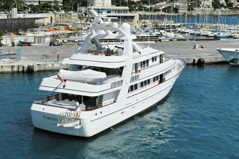 a white boat in a harbor aboard CORINTHIAN Yacht for Sale