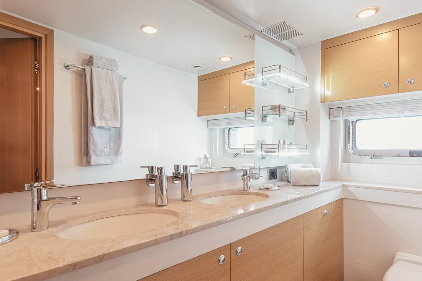 a bathroom with a sink and a mirror aboard XO OF THE SEAS Yacht for Sale