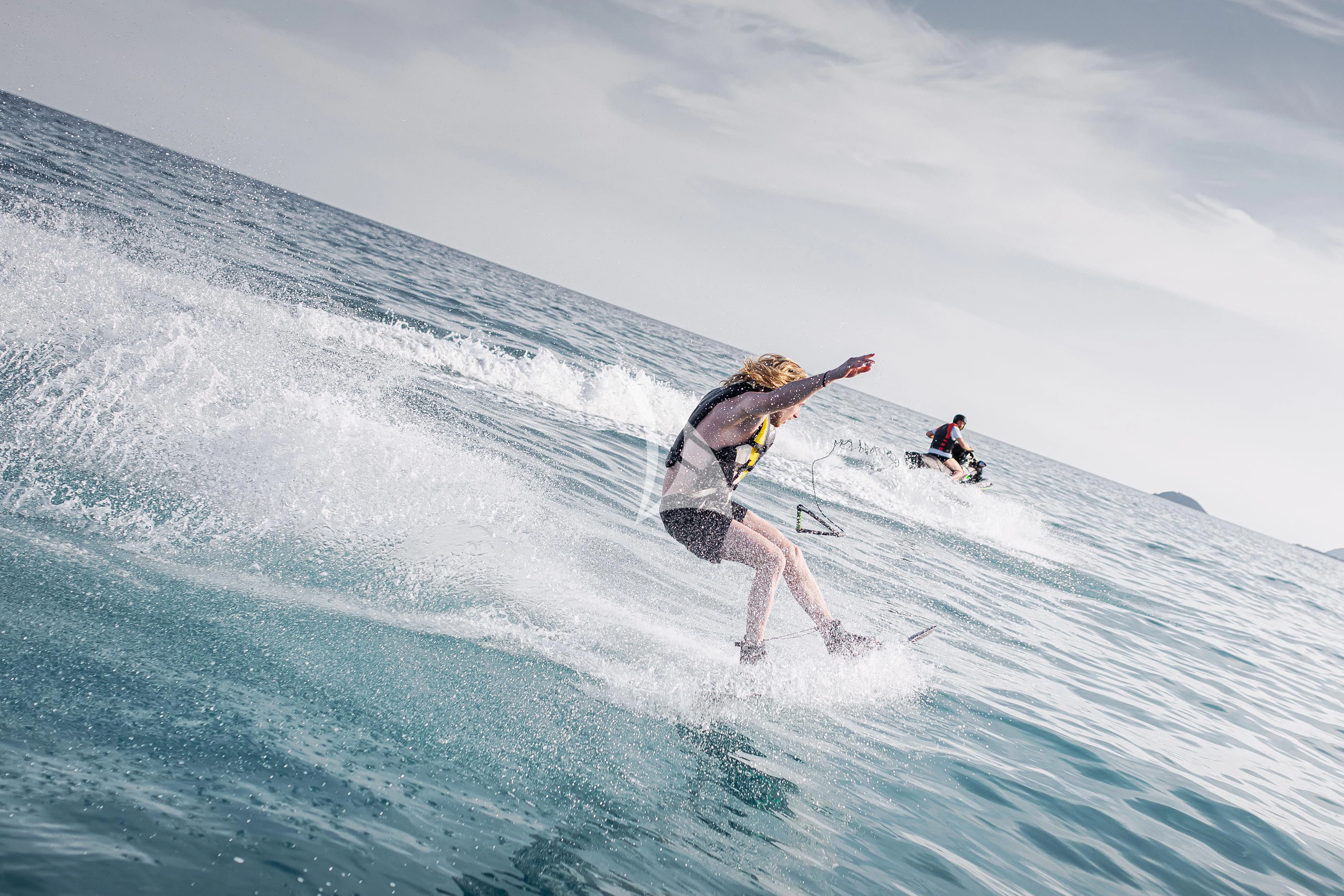 a person surfing on a wave aboard XO OF THE SEAS Yacht for Sale