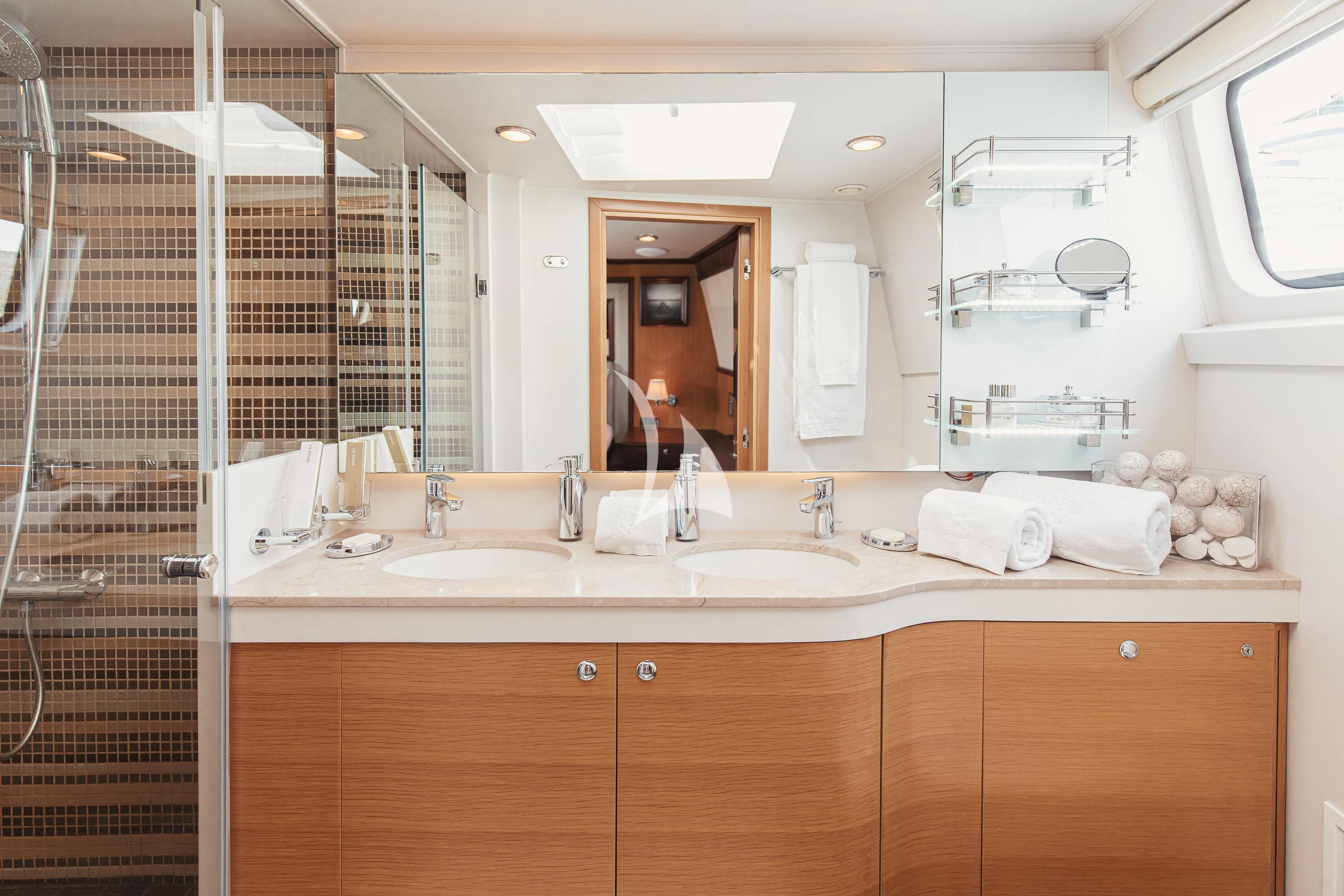 a bathroom with a large mirror aboard XO OF THE SEAS Yacht for Sale