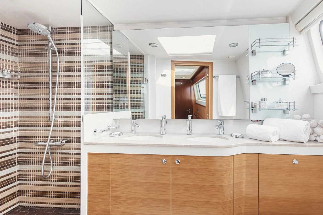 a bathroom with a shower unit and sink aboard XO OF THE SEAS Yacht for Sale