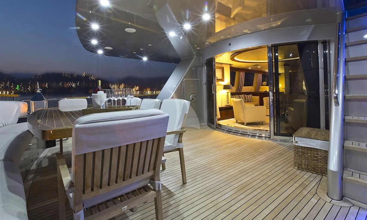 a room with a table and chairs aboard XO OF THE SEAS Yacht for Sale